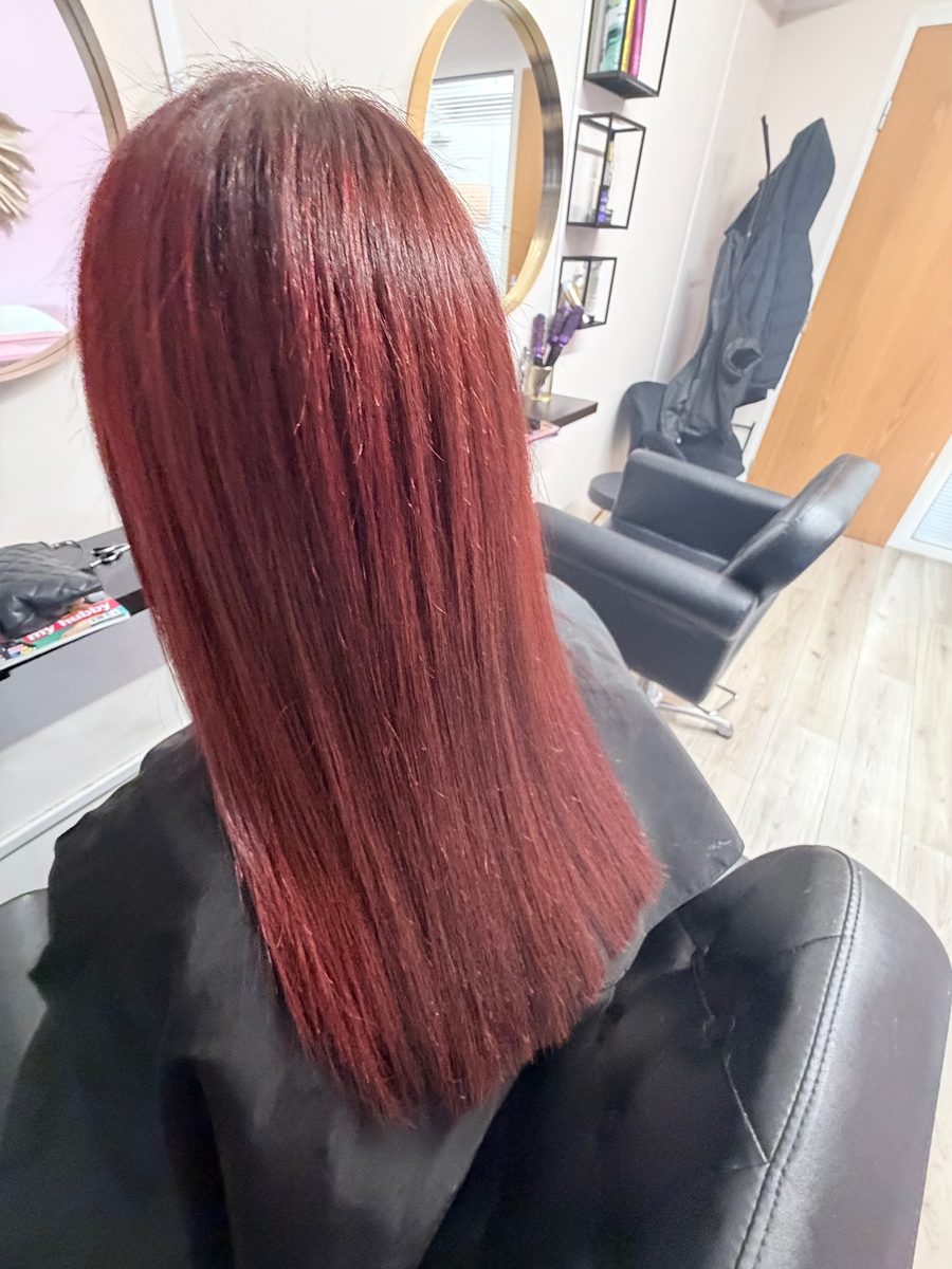 Vivid burgundy red full head colour, straight and glossy