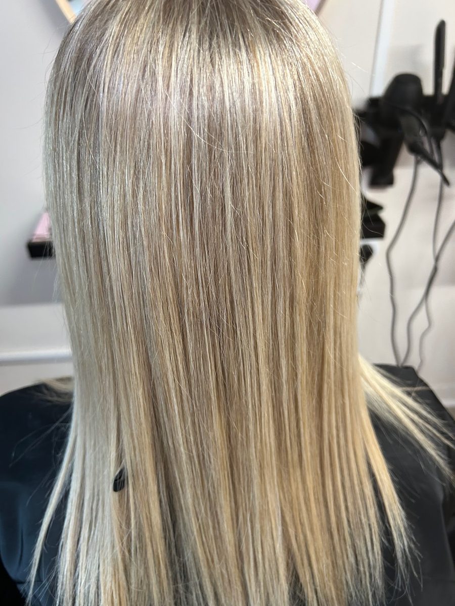Silvery blonde full head highlights, sleek finish