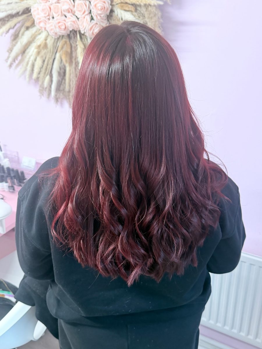 Deep cherry red colour styled in soft waves